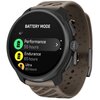 Na zdjęciu widoczny jest smartwatch z wyświetlaczem pokazującym tryby baterii: "BATTERY MODE" z opcjami "Performance 55 hours", "Endurance 65 hours" i "Ultra 90 hours". Pasek zegarka jest beżowy, a na obudowie widnieje logo "SUUNTO".
