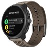 Beżowo-czarny smartwatch z okrągłym wyświetlaczem pokazuje tryb baterii z opcjami: "Performance 55 hours", "Endurance 65 hours" i "Ultra 90 hours". Na obudowie widoczne jest logo "SUUNTO".