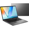 Laptop z otwartym ekranem wyświetlającym kolorową grafikę z napisem "ASUS VIVOBOOK", obok widoczna jest zamknięta pokrywa z tym samym napisem. Klawiatura jest czarna, a obudowa ma metaliczny odcień.