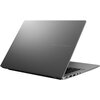Na zdjęciu widoczny jest laptop z otwartą pokrywą, na której znajduje się napis "ASUS VIVOBOOK". Obudowa laptopa ma metaliczne wykończenie, a na boku widać kilka portów.