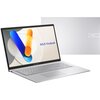 Na zdjęciu widoczny jest otwarty laptop z ekranem wyświetlającym kolorową grafikę i napis "ASUS Vivobook", obok znajduje się zamknięta pokrywa laptopa z logo "ASUS Vivobook". Laptop ma srebrną obudowę i pełnowymiarową klawiaturę.