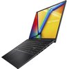 Laptop z otwartym ekranem wyświetlającym kolorowy obraz z napisem "ASUS Vivobook". Klawiatura jest pełnowymiarowa, a obudowa ma ciemny kolor.