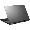 Szary laptop z widocznym logo w kształcie litery "V" na pokrywie, z klawiaturą podświetlaną na pomarańczowo. Laptop jest częściowo otwarty, ukazując boczne otwory wentylacyjne.