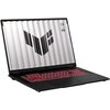 Czarny laptop z podświetlaną na czerwono klawiaturą, na ekranie widoczne jest logo w kształcie litery "V" oraz napisy "TUF" i "VISUAL TESTED". Obudowa ma matowe wykończenie, a ekran jest otwarty pod kątem.