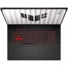 Laptop z otwartym ekranem i podświetlaną klawiaturą, na której klawisze W, A, S, D są wyróżnione czerwonym kolorem. Na ekranie widoczne jest logo TUF oraz napis "TUF Gaming".