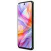 Smartfon z dużym, kolorowym wyświetlaczem o abstrakcyjnym wzorze, z widocznym przyciskiem w kolorze czerwonym na boku obudowy. Obudowa urządzenia jest w kolorze zielonym.