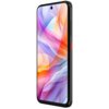 Na zdjęciu widoczny jest smartfon z dużym, kolorowym wyświetlaczem, na którym dominują abstrakcyjne wzory w odcieniach różu, pomarańczu i fioletu. Obudowa urządzenia jest ciemna, z widocznymi przyciskami bocznymi, w tym jednym w kolorze czerwonym.