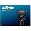 Na zdjęciu widoczna jest golarka z czarną rączką i pomarańczowym akcentem, a obok niej znajduje się napis "Gillette ProGlide" na niebieskim tle.
