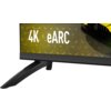 Fragment telewizora z widocznym napisem "4K eARC" na ekranie, z czarną podstawą i częścią obudowy. W tle widoczny jest fragment żółtego samochodu.