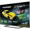 Telewizor z wyświetlonym obrazem przedstawiającym żółty samochód wyścigowy z numerem 60 oraz twarz kierowcy w kasku, z logo "BLAUPUNKT" i "Google TV" na górze. Na ekranie widoczne są napisy: "4K", "QLED", "MEMC", "Dolby ATMOS", "IRON LYNX MOTORSPORT LAB",