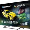 Na zdjęciu widoczny jest telewizor z logo "BLAUPUNKT" oraz "Google TV", a także żółty samochód wyścigowy z napisem "IRON LYNX MOTORSPORT LAB". Na ekranie znajdują się napisy: "4K QD-MiniLED", "Dolby VISION IQ", "Series MBG7000", "65"".