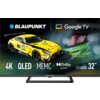 Na zdjęciu widoczny jest telewizor z grafiką przedstawiającą żółty samochód wyścigowy oraz twarz kierowcy w kasku, z logo "BLAUPUNKT" i "Google TV" u góry. Na dole znajdują się napisy: "4K", "QLED", "MEMC", "Dolby Audio", "Series QBG6000", oraz "32"".