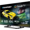 Na zdjęciu widoczny jest telewizor z wyświetlonym obrazem samochodu wyścigowego oraz twarzy kierowcy w kasku, z logo "BLAUPUNKT" i "Google TV" na górze. Na ekranie znajdują się napisy: "4K", "QLED", "MEMC", "Dolby AUDIO", "QBG6000 Series", "32"", oraz "IR