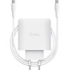 Biały zasilacz do laptopa z dwoma portami USB-C, z widocznym logo "Trust" na obudowie. Kabel jest owinięty wokół zasilacza, a wtyczka jest skierowana w dół.