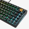Czarna klawiatura mechaniczna z podświetleniem RGB, posiadająca klawisze z oznaczeniami takimi jak "backspace", "delete", "ascend", "shift", oraz pokrętło z logo przedstawiającym stylizowaną głowę. Klawisze funkcyjne F8-F12 są widoczne, a podświetlenie zm