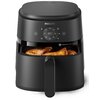Czarna frytkownica beztłuszczowa marki PHILIPS z wyświetlaczem cyfrowym pokazującym temperaturę 180°C oraz ikonami programów. W otwartym koszu znajdują się upieczone kawałki kurczaka, a na urządzeniu widoczny jest napis "RapidAir Technology".