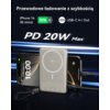 Na zdjęciu znajduje się powerbank indukcyjny z widocznym logo "qi" na środku, otoczony dwoma smartfonami, z których jeden pokazuje godzinę 10:00 i datę "Friday, June 16". Na górze widnieje tekst: "Przewodowe ładowanie z szybkością", "iPhone 16 30 minut", 