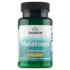 Zielona butelka z czarną zakrętką zawiera suplement diety SWANSON Melatonina, na etykiecie widnieje napis: "Melatonin, Sleep Support, 1 mg per capsule, Dietary Supplement, 120 Capsules". W tle widoczne są kapsułki.
