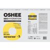 Opakowanie produktu "OSHEE ISO Hydration" z napisem "Hydro Synergy Complex" i informacjami o składnikach, takich jak 5 elektrolitów i 9 witamin. Widoczny jest również smak cytrynowy, oznaczenie BCAA oraz masa netto 1050 g.