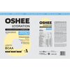 Opakowanie produktu "OSHEE Hydration Zero" o smaku cytrynowym zawiera informacje o składnikach, takich jak 5 elektrolitów (sód, potas, chlorek, magnez, cynk) i 9 witamin, oraz hasła "ZERO SUGAR" i "HYDRO SYNERGY COMPLEX". Widoczna jest również tabela wart