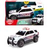 Zabawka przedstawia biały samochód policyjny z niebieskimi i czerwonymi światłami na dachu, oznaczony napisem "POLICE INTERCEPTOR" oraz logo "DICKIE TOYS". Opakowanie zawiera napisy "TRY ME", "LIGHT & SOUND", "3+" oraz logo Ford.