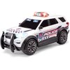 Biały model policyjnego samochodu zabawkowego z napisem "POLICE INTERCEPTOR" na boku, posiada czarne szyby, czarne koła oraz niebieskie i czerwone światła na dachu. Na przodzie widoczny jest napis "DICKIE TOYS".