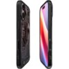 Czarne etui na telefon z przezroczystymi elementami, ukazujące wewnętrzne wzory i okrągły kształt na tylnej części, z widocznym napisem "SPIGEN" oraz przyciskami na bokach. Obok etui znajduje się telefon z wyświetlaczem pokazującym gradientowe kolory od c