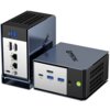 Na zdjęciu widoczne są dwa komputery GMKTEC w metalicznych obudowach z różnymi portami, w tym USB, HDMI, LAN oraz przyciskiem zasilania. Na obudowach znajduje się logo "GMKTEC".