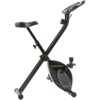 Czarny rower magnetyczny z napisem "TUNTURI Star Fit X100" na obudowie mechanizmu. Rower posiada regulowane siodełko i pedały z paskami.