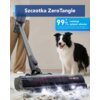 Odkurzacz z widoczną szczotką ZeroTangle i logo "TINECO" na dywanie z sierścią, obok stoi pies. Na górze zdjęcia znajduje się napis "Szczotka ZeroTangle", a obok informacja "99% redukcja splątań włosów" z przypisem dotyczącym danych laboratoryjnych.