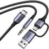 Na zdjęciu widoczne są trzy kable z różnymi złączami: USB, USB-C i mini jack, z plecionymi osłonami. Na jednym z kabli znajduje się napis "UGREEN", a na innym symbol błyskawicy.