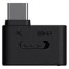 Czarny adapter z wtykiem USB-C, posiadający oznaczenia "PC" i "OTHER" oraz trzy małe diody w kształcie kropek. Adapter ma prostokątny kształt z zaokrąglonymi krawędziami.
