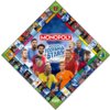 Plansza gry Monopoly World Football Stars z logo Monopoly na środku, otoczona zdjęciami piłkarzy i kolorowymi polami gry. Widoczny jest napis "World Football Stars" oraz logo Hasbro Gaming.