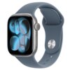 Smartwatch z granatowym paskiem, wyświetlający abstrakcyjny wzór z niebieskimi i czarnymi kształtami na ekranie. Pasek ma metalowe zapięcie z okrągłym przyciskiem.