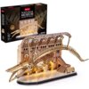 Na zdjęciu znajduje się model 3D przedstawiający szkielet płetwala błękitnego w muzeum, z podświetleniem LED, oraz pudełko z napisem "CubicFun Natural Museum Balaenoptera Musculus". Na pudełku widnieje informacja o liczbie elementów: "222 Pieces" oraz ost
