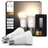 Na zdjęciu widoczne są dwie białe żarówki LED z napisem "hue white 810" oraz opakowanie z logo "PHILIPS hue" i oznaczeniami kompatybilności z "matter", "alexa", "Apple Home" i "Google Home". Obok znajduje się grafika przedstawiająca interfejs aplikacji do