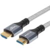 Na zdjęciu widoczny jest kabel HDMI z plecionym oplotem, zakończony dwoma wtykami HDMI w metalicznych obudowach. Na jednym z wtyków znajduje się napis "MONTIS".