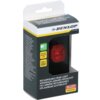 Pudełko z lampką rowerową marki Dunlop, z widocznym czerwonym światłem LED i napisami: "RECHARGEABLE REAR LIGHT", "SUPER BRIGHT LED", "USB-C", oraz oznaczeniem "StVZO zugelassen". Na opakowaniu znajduje się logo Dunlop i dodatkowe informacje w kilku językach.
