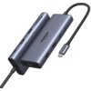 Na zdjęciu widoczny jest hub USB typu C w kolorze szarym z kilkoma portami, w tym HDMI i USB, oraz tekstem "UGREEN 4K 60Hz" na obudowie. Kabel z końcówką USB typu C również ma napis "UGREEN".
