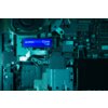 Zdjęcie przedstawia wnętrze komputera z widocznym dyskiem SSD oznaczonym jako "goodram Core NVMe M.2 1TB PCIe 4x4". Wokół dysku znajdują się różne elementy elektroniczne i złącza na płycie głównej.