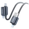 Na zdjęciu widoczny jest szary kabel z czterema różnymi końcówkami: USB, USB-C, USB-C i Lightning, z plecionym oplotem. Na obudowach końcówek znajduje się napis "MOCOLL".