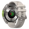Smartwatch z szarym paskiem, widoczny od spodu, z okrągłym czujnikiem i kolorowymi diodami. Na obudowie znajdują się napisy: "MADE IN CHINA - ZEBLAZE VIBE 8", "BUILT-IN FLASHLIGHT", "INPUT: 5V-1A" oraz symbole certyfikacji.