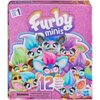 Opakowanie zestawu figurek "Furby Minis" z serii 1, przedstawia kolorowe figurki z dużymi oczami i różnorodnymi fryzurami na tle fioletowego wzoru. Na dole widnieje napis "12 figures" oraz ostrzeżenie: "WARNING: CHOKING HAZARD - Small parts. Not for child