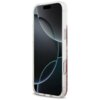 Przezroczyste etui na telefon z różowymi elementami i brokatem, zaprojektowane dla modelu Apple iPhone 17 Pro Max, z widocznymi przyciskami bocznymi. Na ekranie telefonu wyświetlany jest abstrakcyjny wzór z ciemnymi i jasnymi okręgami.
