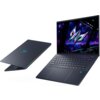 Na zdjęciu widoczny jest otwarty laptop z kolorowym ekranem przedstawiającym futurystyczną grafikę oraz zamknięty laptop z widocznym logo w kształcie stylizowanej litery "M". Klawiatura laptopa jest podświetlana, a obudowa ma ciemny kolor.