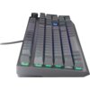 Na zdjęciu widoczna jest klawiatura mechaniczna z podświetleniem RGB, z klawiszami w odcieniach szarości. Klawisze są podświetlone na różne kolory, w tym zielony i niebieski, a w górnej części znajduje się pokrętło.