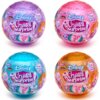Na zdjęciu widoczne są cztery kolorowe kule z serii "Disney Crystal Surprise" z napisem "What will you get?" oraz "Mix & Play Surprise Activity!", każda z logo Cra-Z-Art i oznaczeniem "Series 1". Kule mają różne kolory: fioletowy, różowy, niebieski i poma