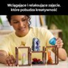 Na zdjęciu widoczny jest zestaw "LEGO 21362 IDEAS Kolekcja minerałów" marki "LEGO", składający się z różnych kolorowych elementów przypominających minerały, umieszczonych na trzech brązowych stojakach. Na górze zdjęcia znajduje się tekst: "Wciągające i re