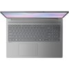 Szary laptop z otwartym ekranem, widziany z góry, z pełnowymiarową klawiaturą i dużym touchpadem. Na obudowie widoczny jest napis "Dolby Audio".