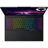 Laptop z podświetlaną klawiaturą w kolorach tęczy, z widocznym logo "Legion" na ekranie. Na klawiaturze znajdują się standardowe klawisze, a nad nią widoczny jest ekran z grafiką przedstawiającą miasto na tle burzowego nieba.